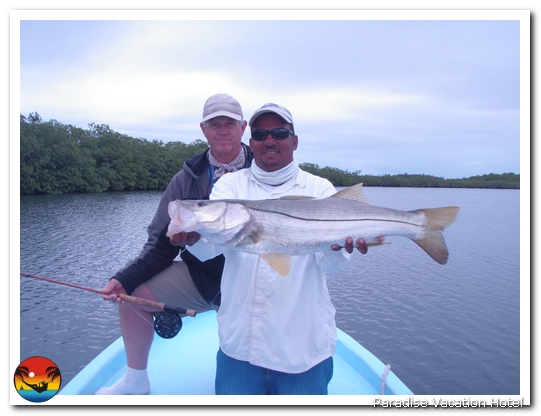Guest with Bruce Leslie during a day of fishing in Placencia by Bruce Leslie